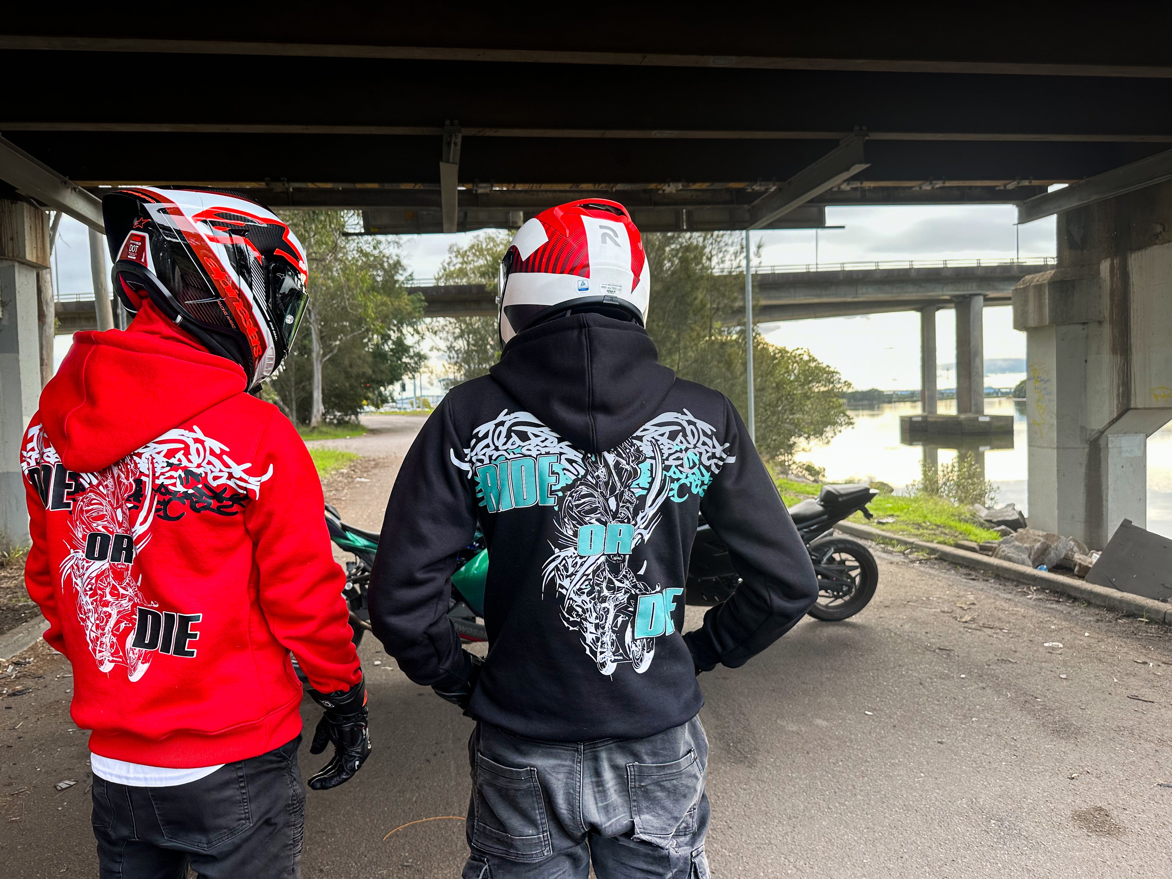 two riders looking at two motorcycles wearing a hoodie with an in built balaclava, reflective panelling